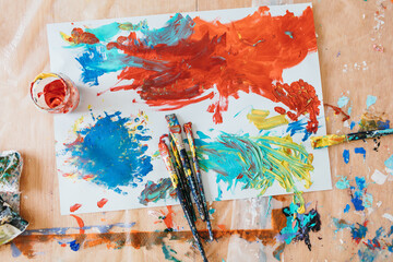 A kid and this father painting at home