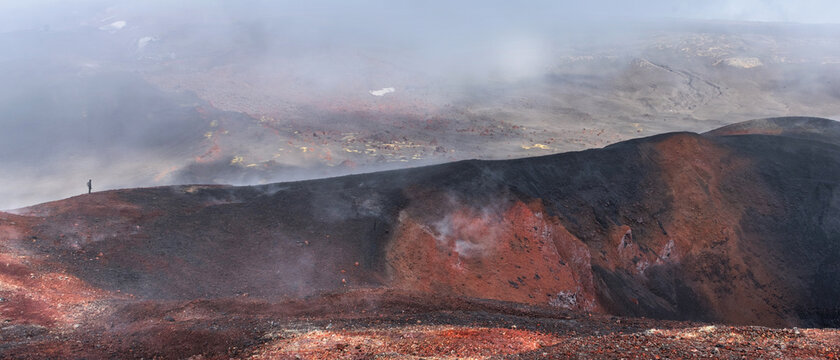 Panoramic view crater of Tolbachic volcano with man, Kamchatka Russia.