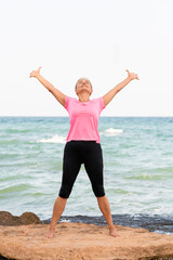 Vertical portrait of woman stretching outdoor