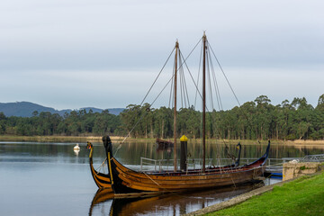 viking boat replicas on the Arousa River in Catoira at the Torre de Oeste Castle