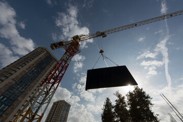 Tower crane. Construction site. Production of apartments, social housing.