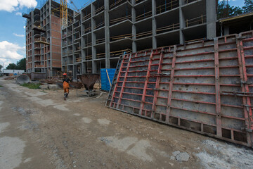 Wall of a multi-storey building, installation of windows. Production of apartments, social housing.