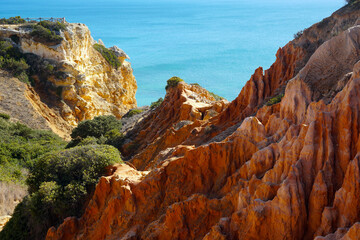 Obraz premium Marinha Beach (Praia da Marina) is a very popular beach with in the Algarve typical rock formations as natural bridges and arches 