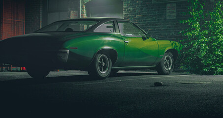 Green classic car in back alley 