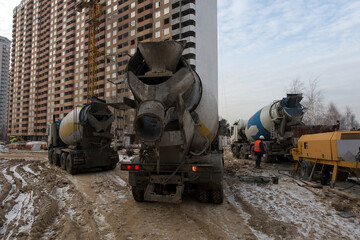 Mixer, concrete mixer. Production of apartments, social housing.