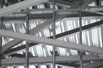 An old steel metal farm. structure of metal structure of frame-type industrial building. Lightweight metal frame construction.