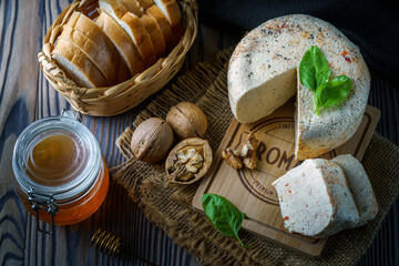Still life with homemade cheese and honey
