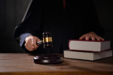 Close up of Judge hand is hitting hammer  judge in courtroom