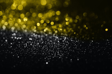 Photo of the texture sparkles bokeh in grey and yellow illuminating colors. Color year 2021.