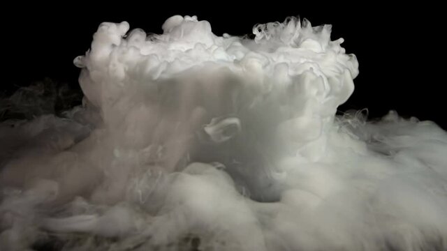 Dry Ice Smoke in cauldron beautiful high quality footage on black background. Shoot on Red Epic Dragon camera.