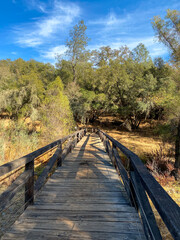 Fototapeta na wymiar Bridge Over New York Creek Along Trail at Lake Folsom California
