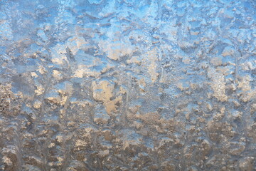 Frost drawing on window glass, snowflake ornament after anomaly ice cold
