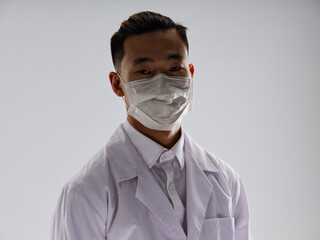 Male doctor medical mask white coat health gray background