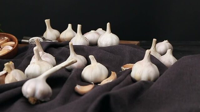Fresh garlic and herbs on table