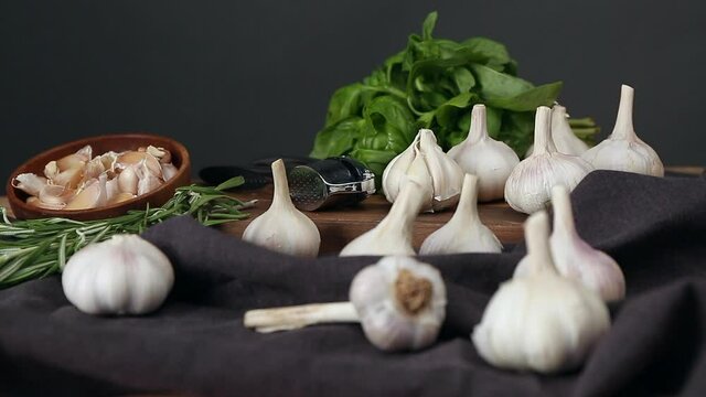 Fresh garlic and herbs on table