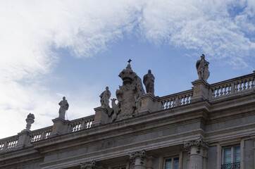 Fototapeta na wymiar Part of Royal Palace facade with statues, Madrid, Spain 