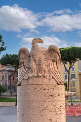 the majestic figure of an eagle on a pedestal on the People's Square in the historic center of Rome