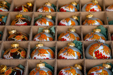Fototapeta na wymiar France. Strasbourg. December 6, 2020. Glass Christmas balls with the symbol of the year of the bull for the Christmas market.