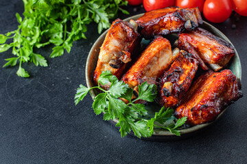 ribs grilled BBQ spices tomato sauce piece of meat second course snack ready to eat on the table meal snack top view copy space for text food background rustic