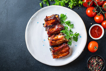 ribs grilled BBQ spices tomato sauce piece of meat second course snack ready to eat on the table meal snack top view copy space for text food background rustic