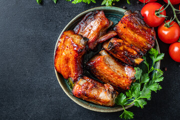 ribs grilled BBQ spices tomato sauce piece of meat second course snack ready to eat on the table meal snack top view copy space for text food background rustic