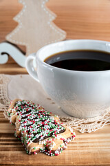 Cup of coffee with christmas tree cookies