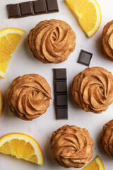 Tasty zephyr with orangeand chocolate flavour on light background