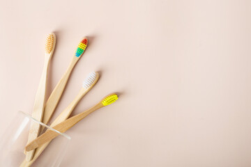 Fototapeta premium bamboo toothbrushes on a beige background