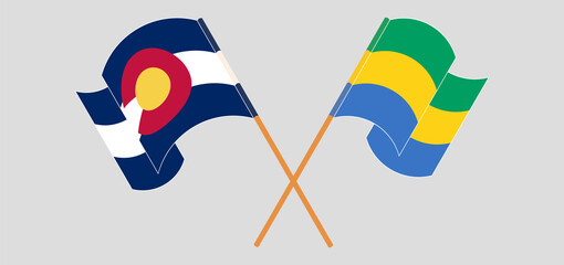 Crossed and waving flags of The State of Colorado and Gabon