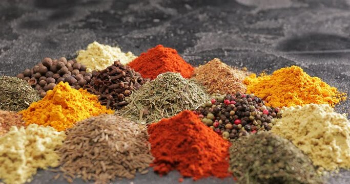 Different spices on dark background