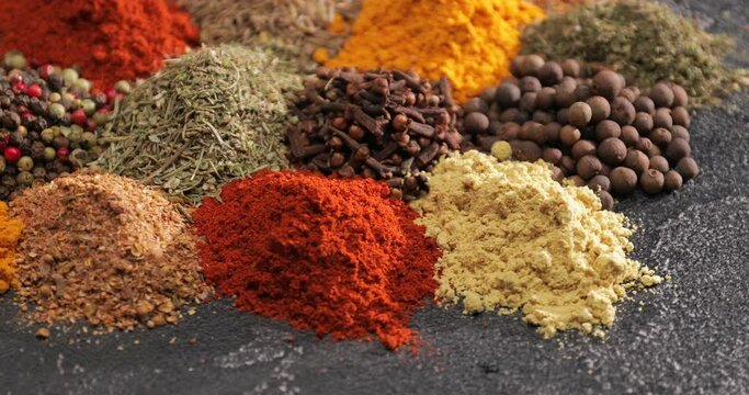 Different spices on dark background