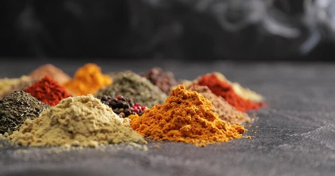 Different spices on dark background