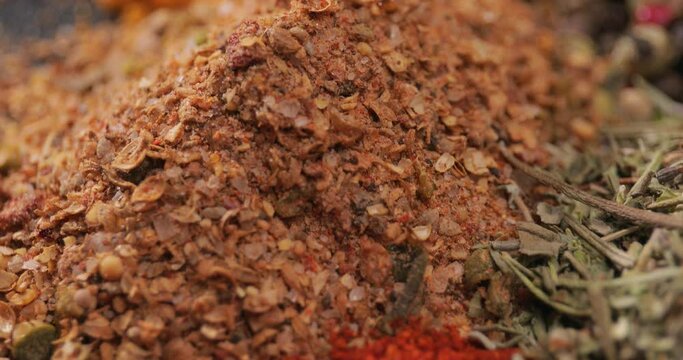 Different spices on dark background, closeup