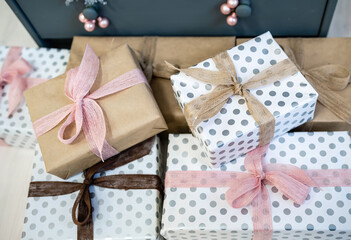 Wrapped boxes with Christmas gifts tied with ribbons