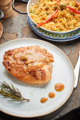 Grilled chicken breast, fillet and fresh vegetable salad and paella rice, olive oil. Healthy lunch menu.