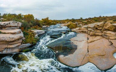 Small fast waterfall Kamenka in the evening light in Ukraine