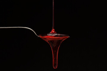 syrup spilling on a spoon
