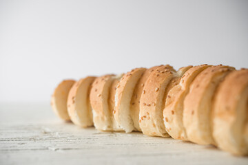 Fresh bread sliced baguette in white background