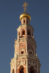Fototapeta premium Orthodox Golden cross on the dome of the Church in Moscow, in the Novodevichy monastery on a Sunny day