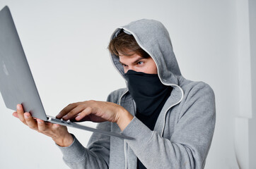 secretive masked man laptop hacker penetration danger