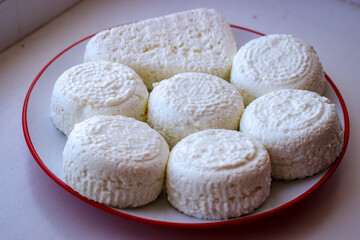 Delicate Circles Of Delicious Cow Cheese Curd Ready To Be Consumed.