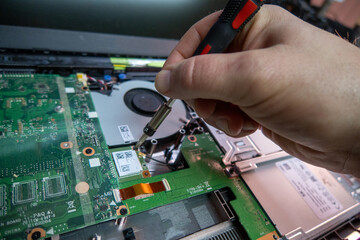 Fototapeta na wymiar opened notebook is repaired in a computer workshop