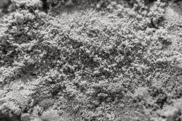 Abstract texture of the grey kinetic sand. Close up. Color 2021.