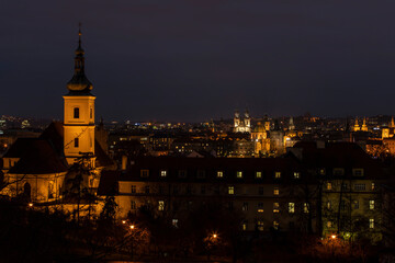 Naklejka premium .light from street lights and a view of the city of Prague