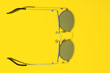 Demonstrating trendy colors 2021 - Gray and Yellow. Sunglasses with Shadow