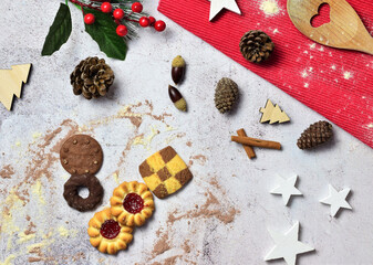 Decorative Christmas background with assorted cookies on the stone.