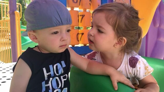 sister wants to kiss her little brother