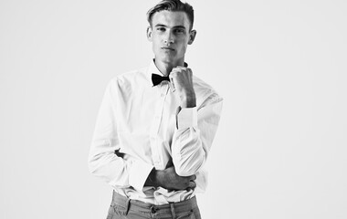 portrait of handsome gentleman in shirt and bow tie