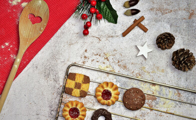 Obraz na płótnie Canvas Background with Christmas decoration, on stone. Assorted cookies placed on the oven rack tray.
