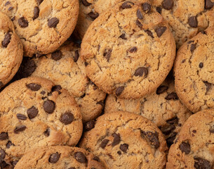 Closeup top view of chocolate chip cookies. Cookies backdrop